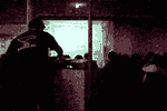 AV technician makes adjustments while author's video plays at the 'New York Underground meets Berlin Underground' event. The precursor work to Ruins in ASCII was projected during this event at the vacant Postdamer Platz U-Bahn station. Thumbnail.